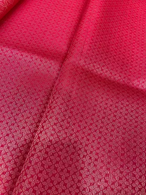 gorgeous coral pink silk saree featuring elegant floral motifs beautifully woven across the body