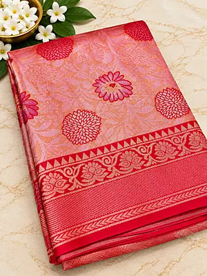 gorgeous coral pink silk saree featuring elegant floral motifs beautifully woven across the body