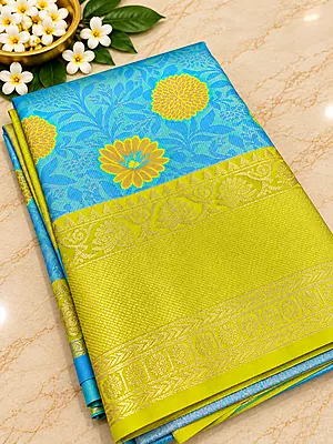 ?? Turquoise Blue & Lime Green Silk Saree
A vibrant turquoise blue silk saree beautifully adorned with golden floral motifs and subtle woven foliage patterns.