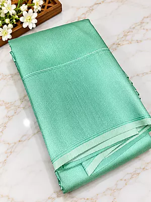 ? Mint Green Silk Saree A stunning mint green silk saree featuring an elegant all-over woven geometric jacquard pattern with a subtle metallic sheen