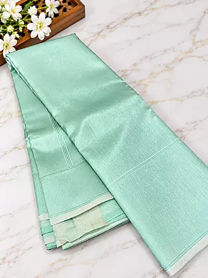 ? Mint Green Silk Saree A stunning mint green silk saree featuring an elegant all-over woven geometric jacquard pattern with a subtle metallic sheen