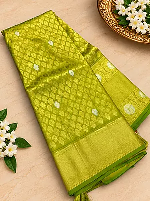 ? Lime Green Silk Saree – Description Make a statement with this vibrant lime green silk saree, crafted with a luxurious sheen and intricate gold zari weaving