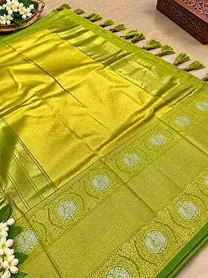 ? Lime Green Silk Saree – Description Make a statement with this vibrant lime green silk saree, crafted with a luxurious sheen and intricate gold zari weaving