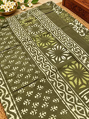 A beautiful olive green saree featuring elegant hand-block inspired prints in soft lime and ivory tones.