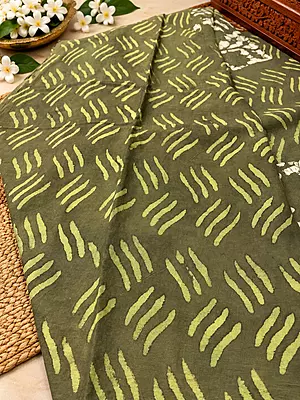 A beautiful olive green saree featuring elegant hand-block inspired prints in soft lime and ivory tones.