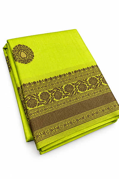 : This stunning light lime-green art silk saree is a perfect blend of traditional charm and contemporary style