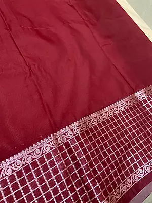 A graceful cream silk saree featuring delicate mauve-toned floral buttas scattered across the body.
