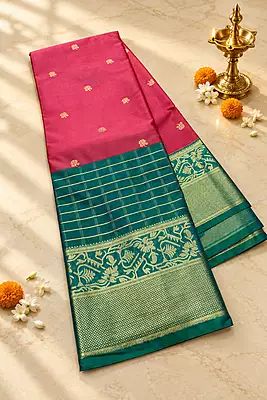 A beautiful rose pink silk saree enhanced with delicate gold zari buttas scattered across the body.