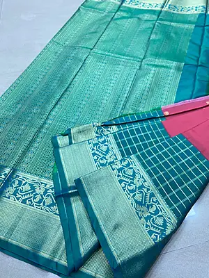 A beautiful rose pink silk saree enhanced with delicate gold zari buttas scattered across the body.