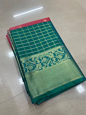 A beautiful rose pink silk saree enhanced with delicate gold zari buttas scattered across the body.