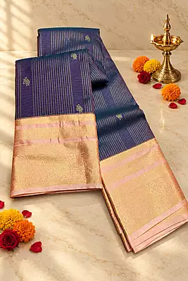 A sophisticated deep navy blue silk saree adorned with fine gold zari checks and traditional motifs.