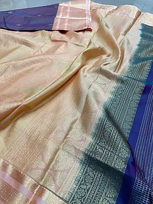 A sophisticated deep navy blue silk saree adorned with fine gold zari checks and traditional motifs.