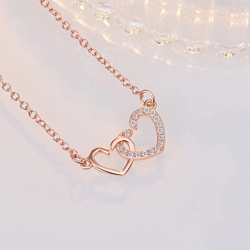 ROSE GOLD PLATED AMERICAN DIAMOND STUDDED DUAL HEART CONTEMPORARY KOREAN PENDANT