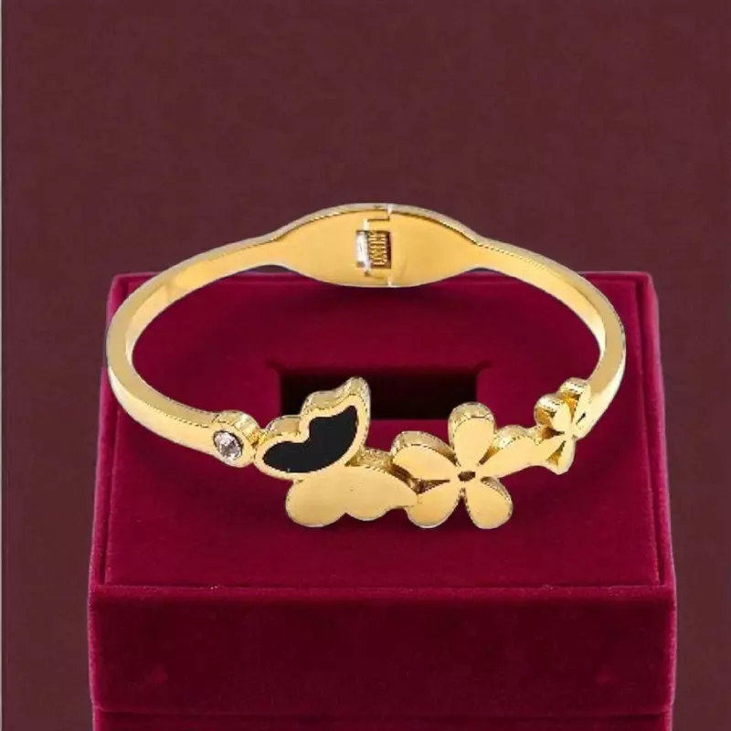 Floral and Butterfly Bangle Bracelet with Black Enamel Detail