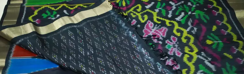 Black ikat silk saree with multicolour temple motifs, zari border and ikat blouse
