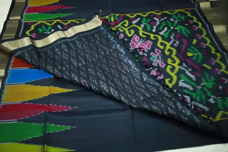 Black ikat silk saree with multicolour temple motifs, zari border and ikat blouse