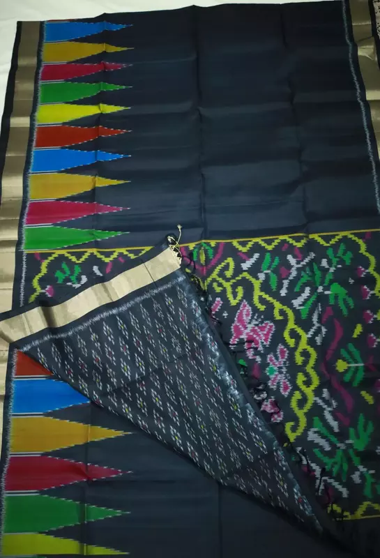 Black ikat silk saree with multicolour temple motifs, zari border and ikat blouse
