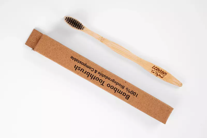 Bamboo toothbrush with charcoal infused soft bristles Bamboo toothbrush with charcoal infused soft bristles