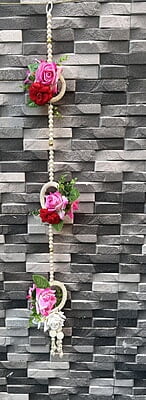Plastic rose with bead string