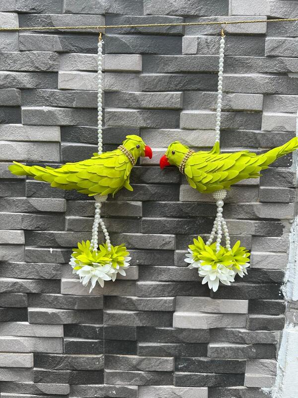 Plastic parrot with parrot hangings