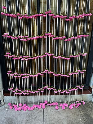 Open lotus flower with beads string