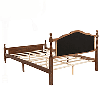 vintage-style wooden bed with an upholstered headboard