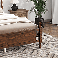 vintage-style wooden bed with an upholstered headboard