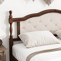 vintage-style wooden bed with an upholstered headboard