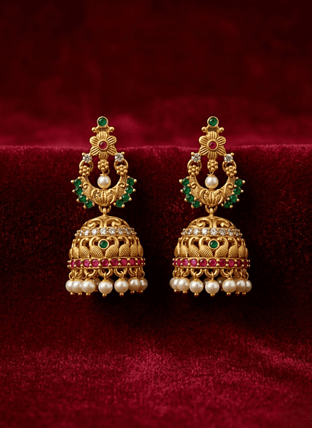 traditional temple-style jhumka earrings.