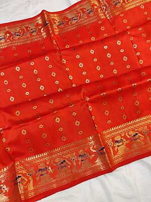 Orange color 2000 buta with figure motif swarnachari saree