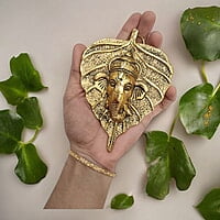 Mini Enamel Leaf Ganesh Gold color Aluminium Idol Mini Enamel Leaf Ganesh Gold color Aluminium Idol