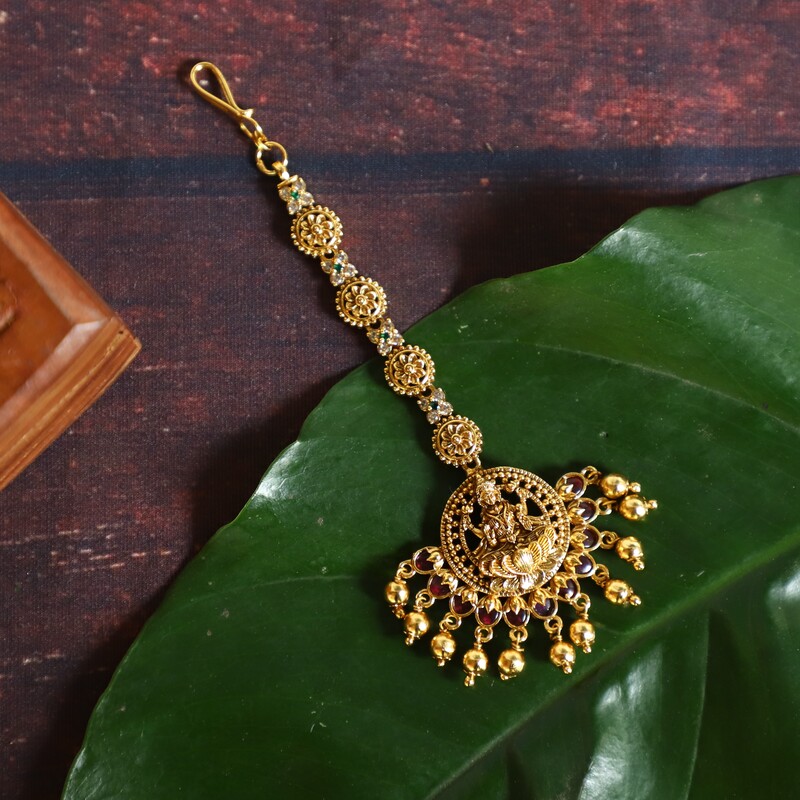 Rupee Lakshmi gold finishing tikka