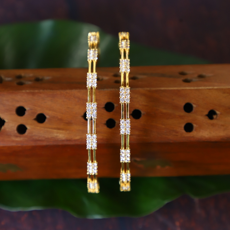 Gold finishing Rubens ad stone bangels