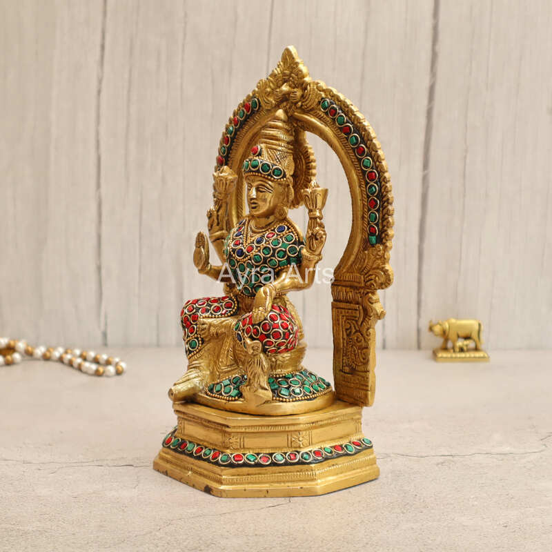 Brass Goddess Lakshmi Seated on Singhasan with Arch in Stonework - 9.5 Inch Height