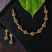 Antic gold finished Peacock design neckpiece with Ruby stone paired with Earings