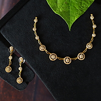 Antic gold finished Peacock design neckpiece with Ruby stone paired with Earings