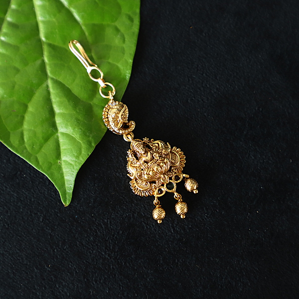 Traditional lakshmi design with border as stone  tikka