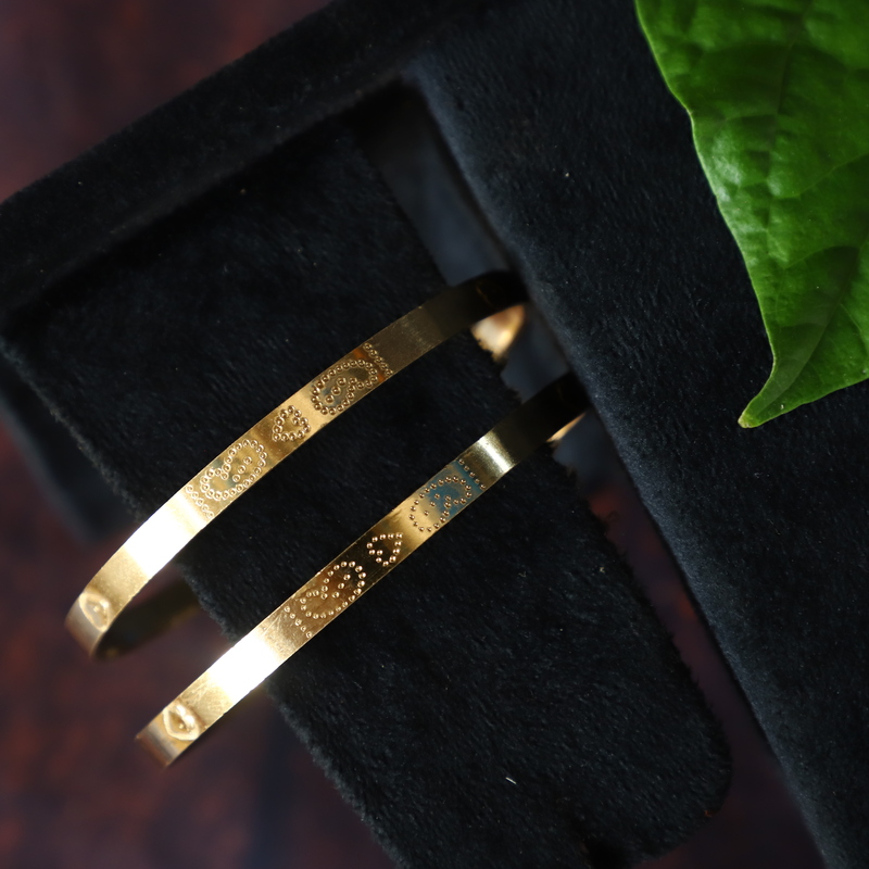 FIVE METAL BANGLES