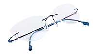 Female Rimless Cat Eye Spectacle Frame. Blue Color Metal Frame.