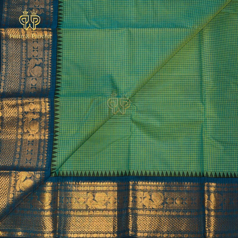 Kanchi cotton Aqua Green saree with woven checks with Black Buttas and royal blue temple zari border