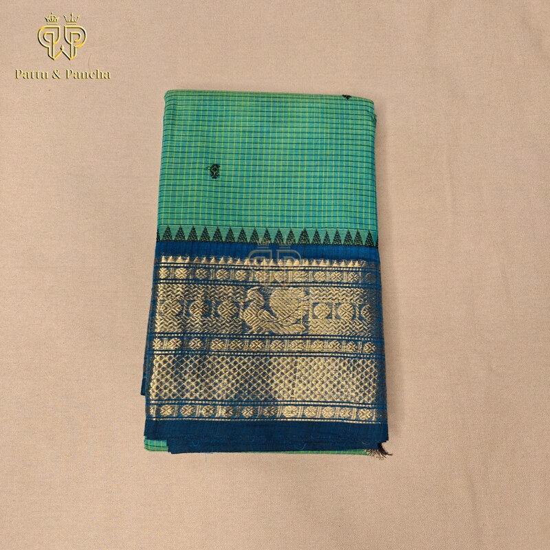 Kanchi cotton Aqua Green saree with woven checks with Black Buttas and royal blue temple zari border