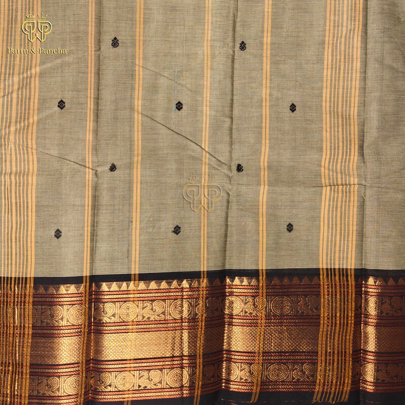 Kanchi Cotton Pastel Mint Green saree with black Buttas and zari border.