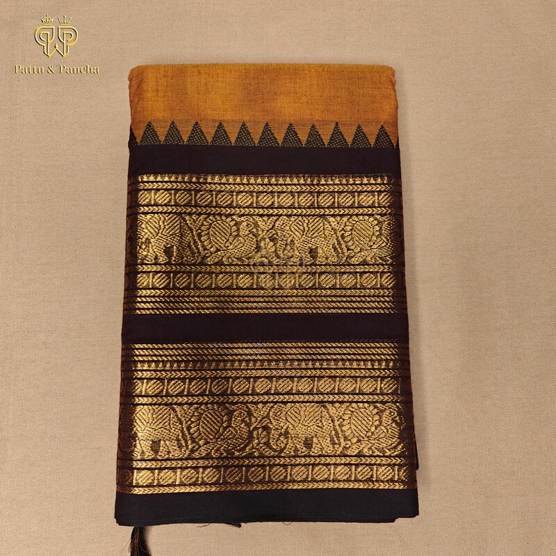 Kanchi Cotton Rust Orange Saree with black temple zari border