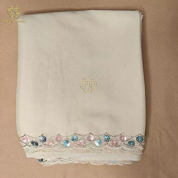 Off White Georgette Saree with Rani Pink Satin Embellished Blouse