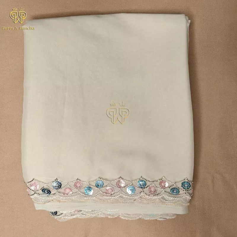 Off White Georgette Saree with Rani Pink Satin Embellished Blouse