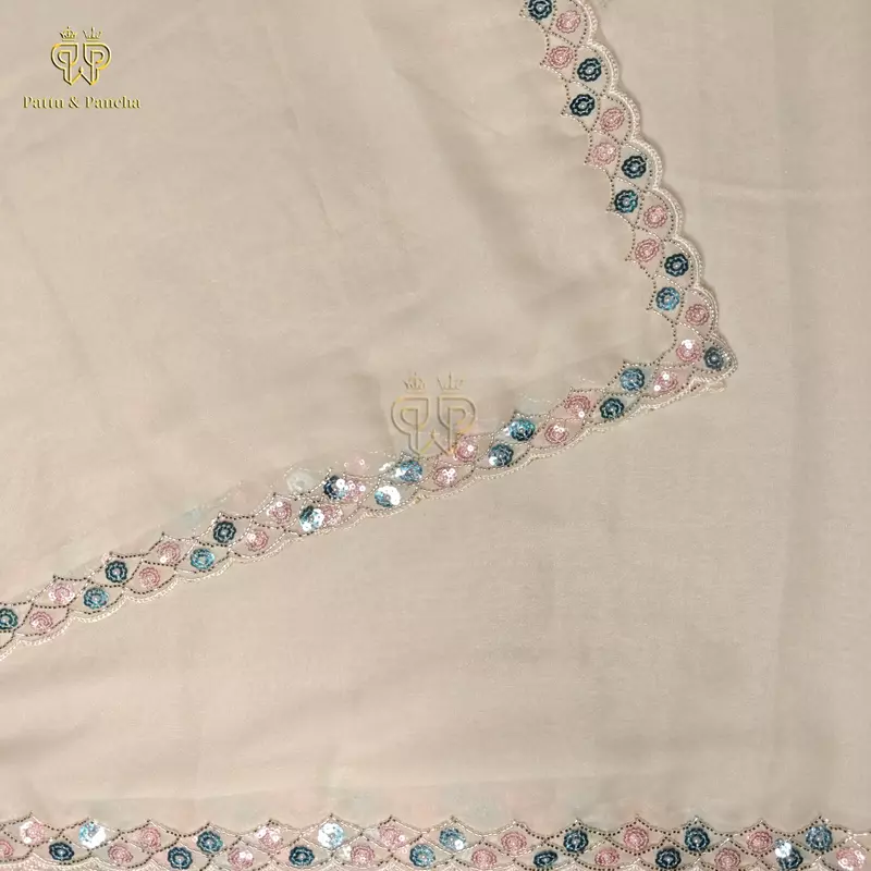 Off White Georgette Saree with Rani Pink Satin Embellished Blouse