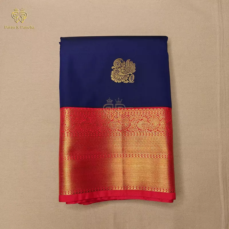 Semi Silk Dark Blue and Orangish Red Saree with Gold Zari Peacock Motifs and Rich Zari Border