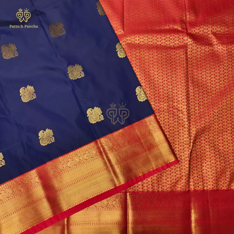 Semi Silk Dark Blue and Orangish Red Saree with Gold Zari Peacock Motifs and Rich Zari Border