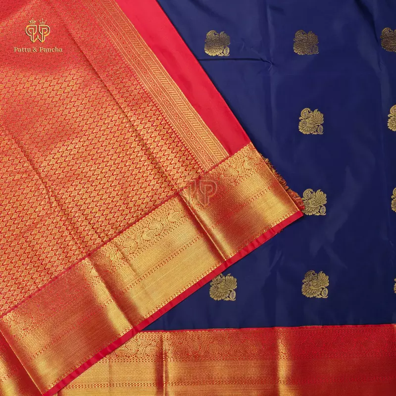 Semi Silk Dark Blue and Orangish Red Saree with Gold Zari Peacock Motifs and Rich Zari Border