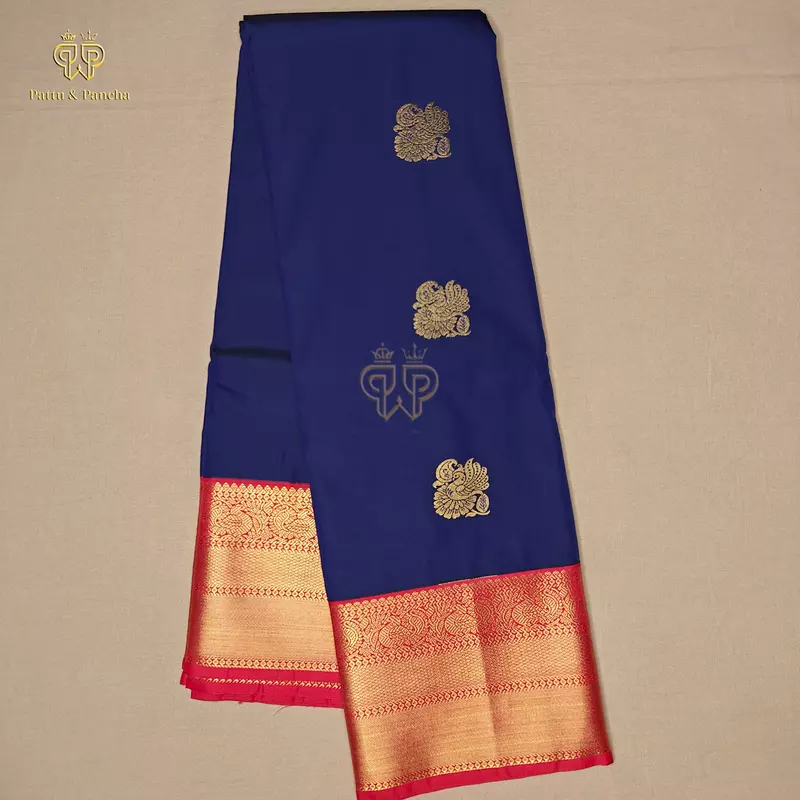 Semi Silk Dark Blue and Orangish Red Saree with Gold Zari Peacock Motifs and Rich Zari Border